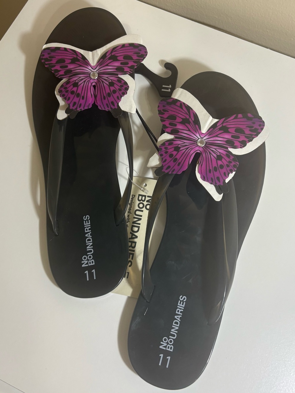 No Boundaries Black Flip Flops with Purple Butterfly Detail